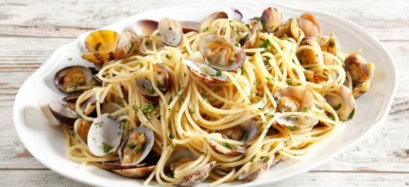White plate filled with seafood pasta